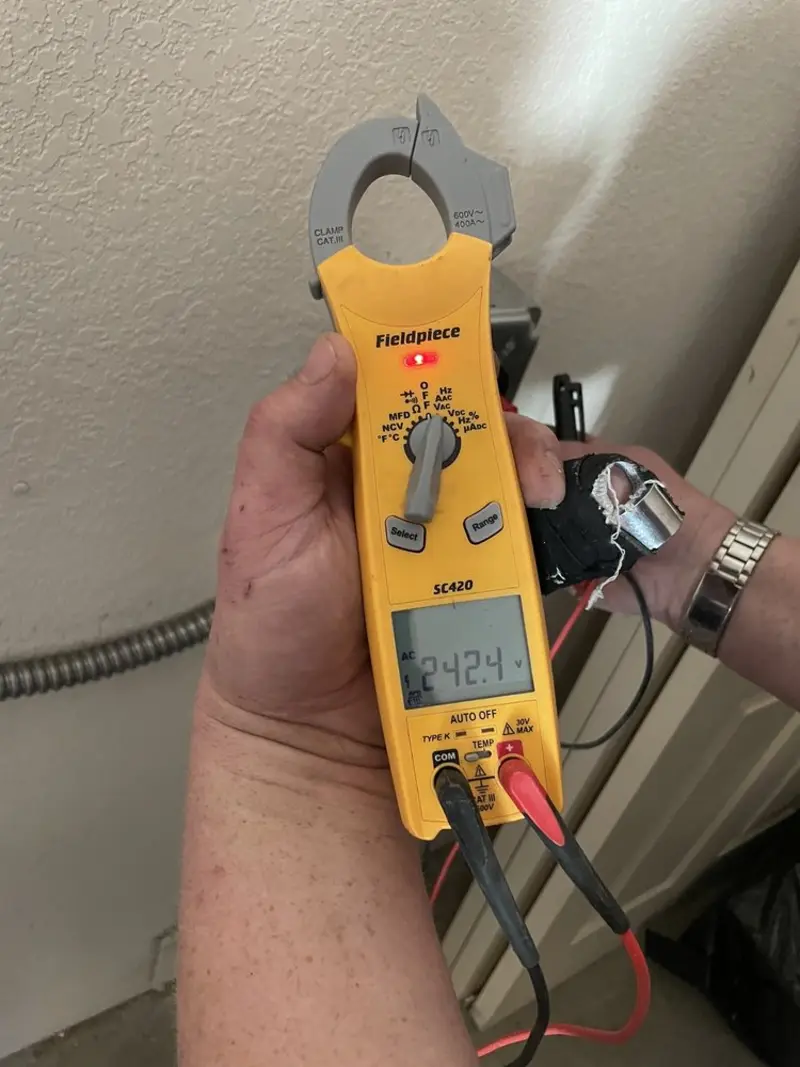 Voltage testing with clamp meter during Electrical Installation Services in Ashton-Sandy Spring